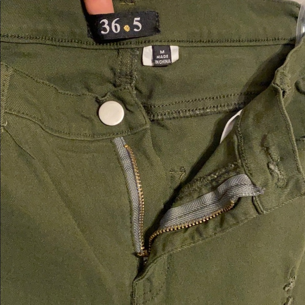 Olive green distressed ripped jeans sizeM